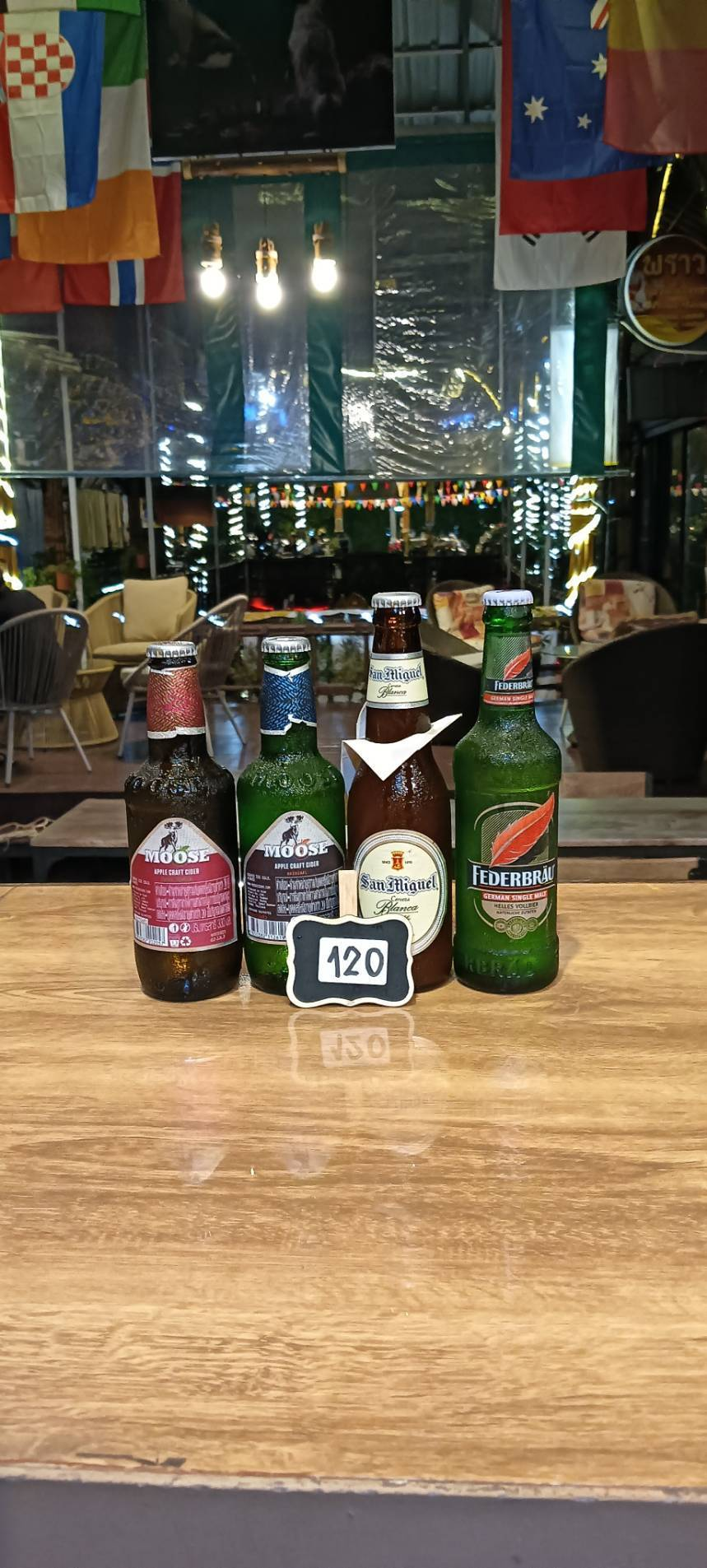Moose Apple Craft Cider, San Miguel and Federbrau bottles, priced at 120 baht