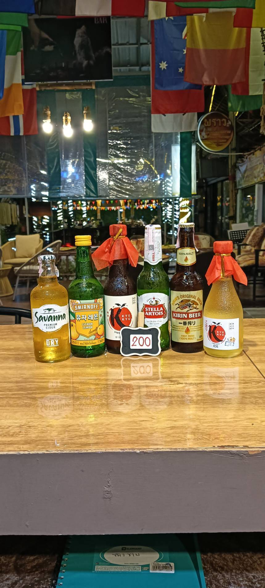 Savanna Dry, Smirnoff, Kyu Kyu Umeshu, Stella Artois, Kirin and Kyu Kyu Ice bottles, priced at 200 baht
