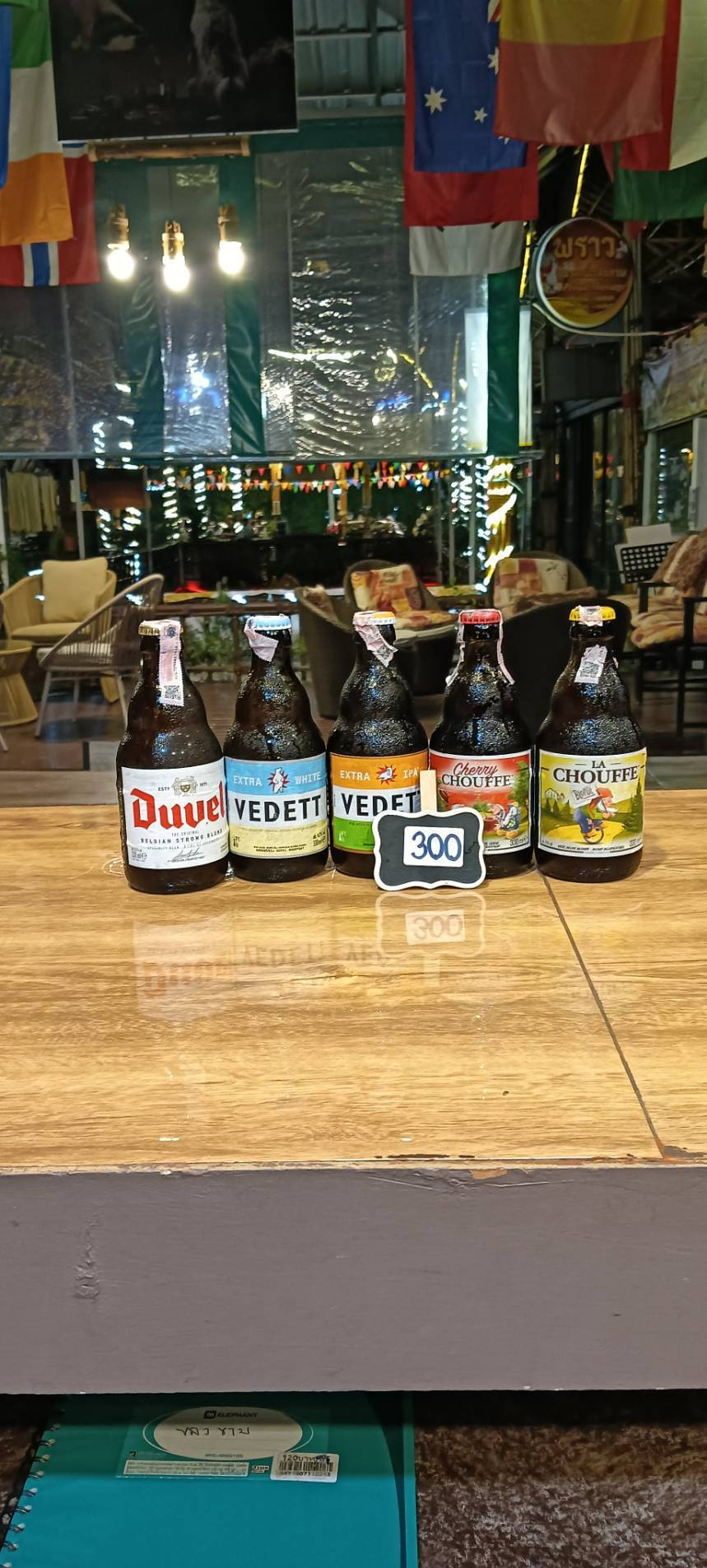 Duvel, Vedett Extra White, Vedett Extra IPA, Cherry Chouffe and La Chouffe bottles, priced at 300 baht