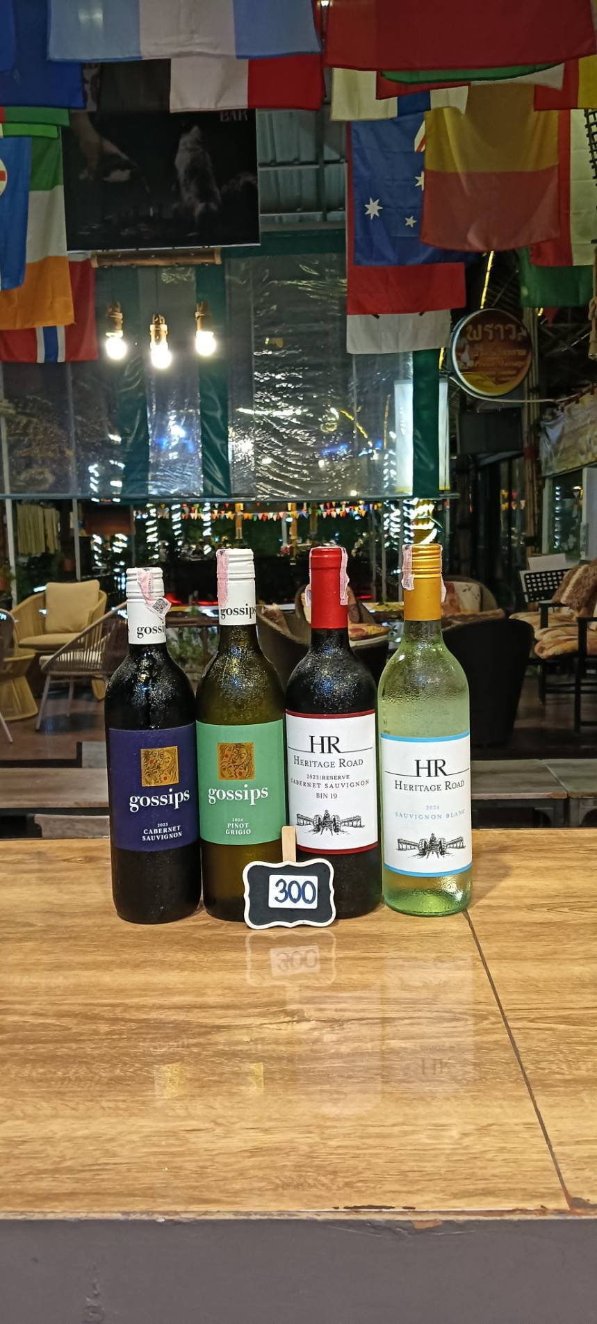 Gossips Cabernet Sauvignon, Gossips Pinot Grigio, Heritage Road Cabernet Sauvignon and Heritage Road Sauvignon Blanc wine bottles, priced at 300 baht