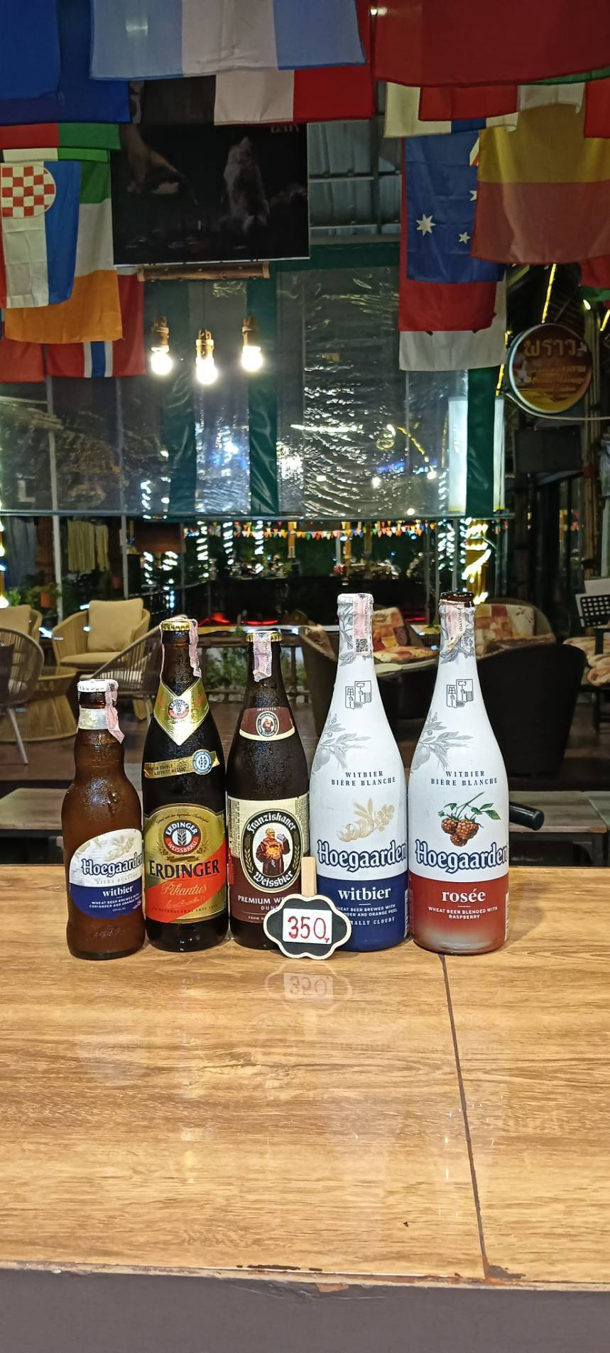 Hoegaarden Witbier, Erdinger Pikantus, Franziskaner Weissbier Dunkel, Hoegaarden Witbier and Hoegaarden Rosée bottles, priced at 350 baht